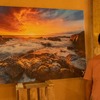 Daniel Cheong and his Sunset photo during photo exhibition at Les Robinsons restaurant